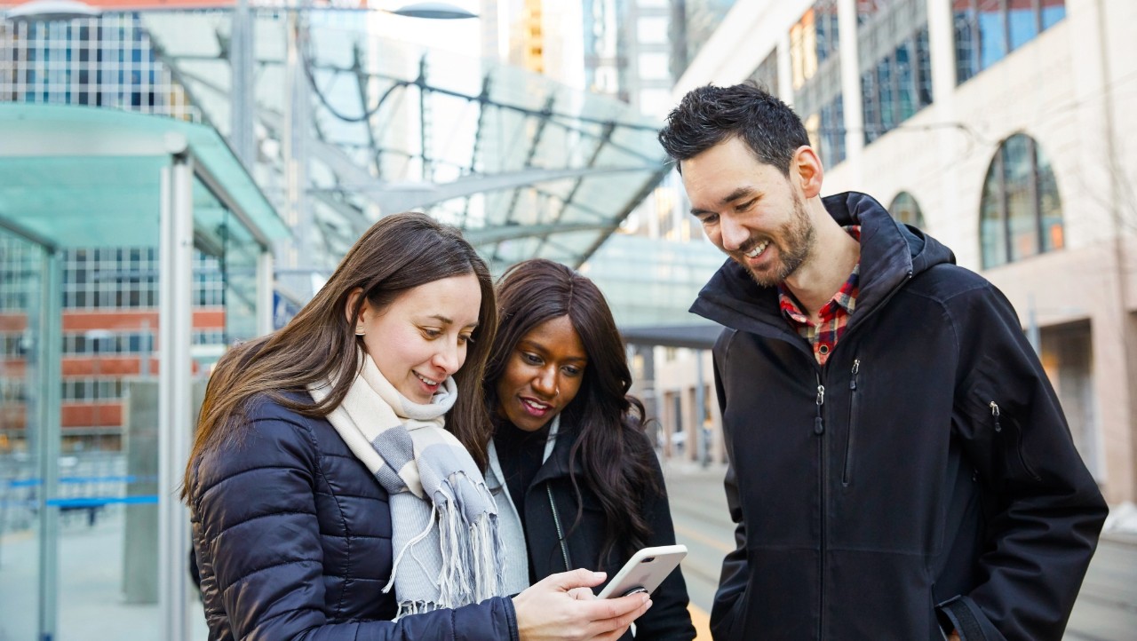 people looking at a phone