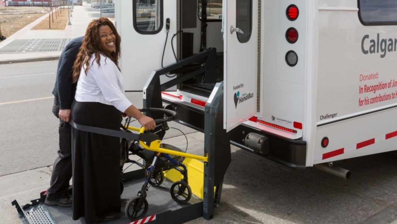 woman being assisted on ramp