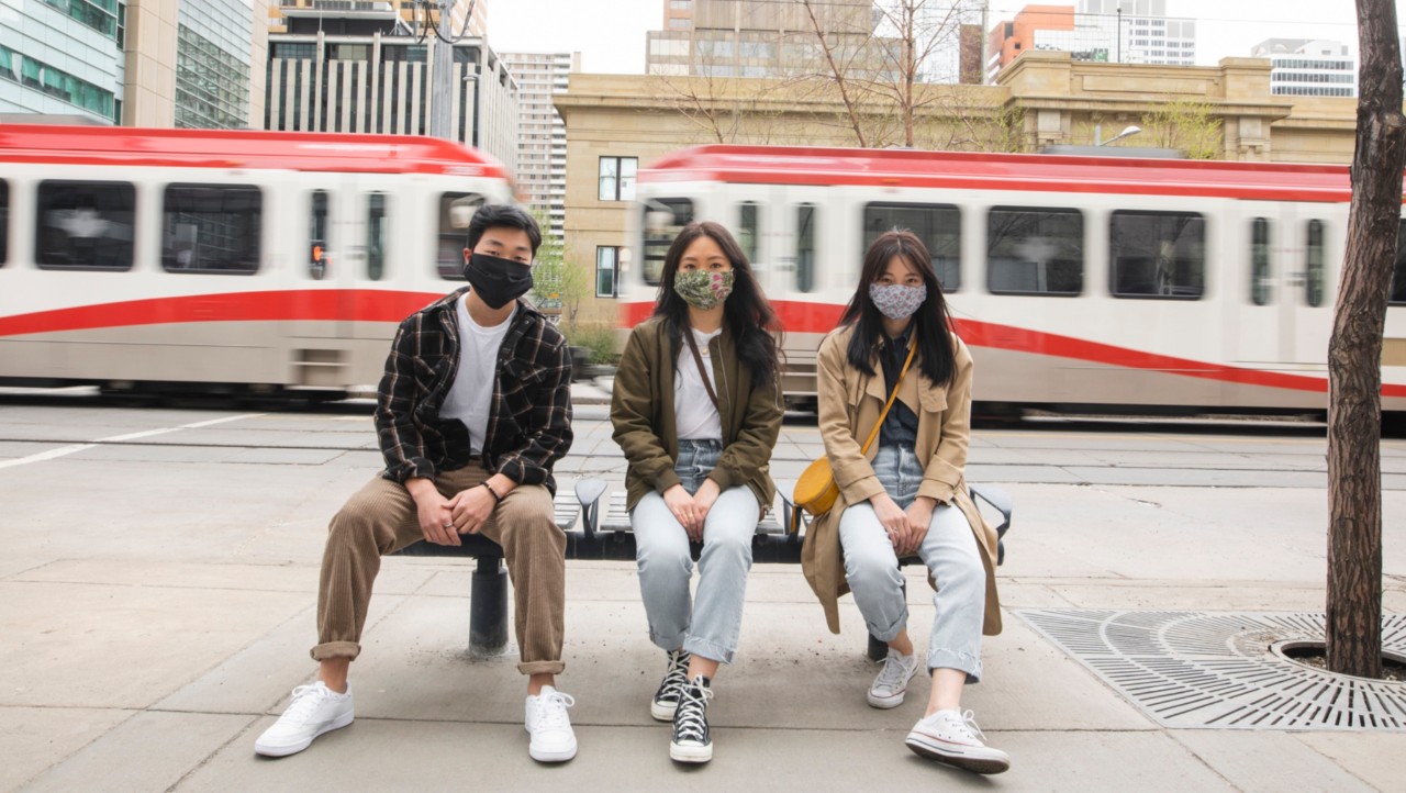 people_with_masks_on_bench